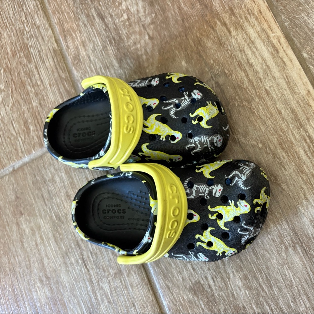 CROCS Dinosaur skeleton pattern.